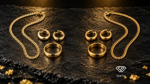 Matching 14K and 18K yellow gold chains, hoop earrings and bands side by side on black slate