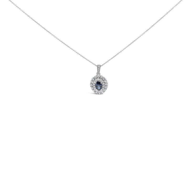 14K White Gold Oval Blue Sapphire and 3/4 Cttw Diamond Halo Pendant Necklace 14K white gold necklace with oval blue sapphire and diamond halo stones