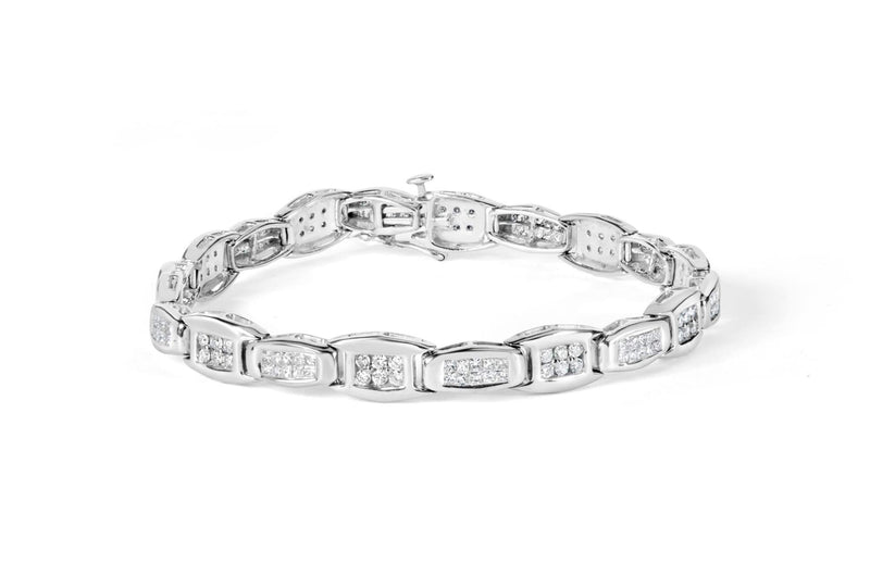 14K White Gold 2-1/2 Cttw Round-Brilliant & Baguette Cut Diamond 7 14K white gold tennis bracelet with alternating round and baguette diamond stones