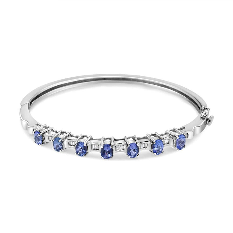 14K White Gold 5 MM Oval Blue Tanzanite and 1/4 Cttw Diamond Bangle (H-I Color, VS2-SI1 Clarity) - Fits wrists up to 7 1/2 Inches 14K white gold bangle with oval blue tanzanite and diamond accent stones