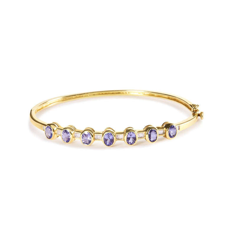 14K Yellow Gold Alternating Bezel Set 5MM Oval Shaped Tanzanite and 1/5 Cttw Diamond Bangle Bracelet (H-I Color, VS2-SI1 Clarity) - Fit's wrists up to 7.25 14K yellow gold bangle bracelet with oval tanzanite and round diamond stones