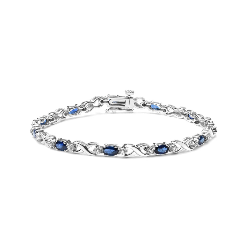 10K White Gold 5x4mm Oval Sapphire Gemstone and 1/10 Cttw Diamond Prong Set 10K white gold bracelet with oval sapphire and diamond X-link stones