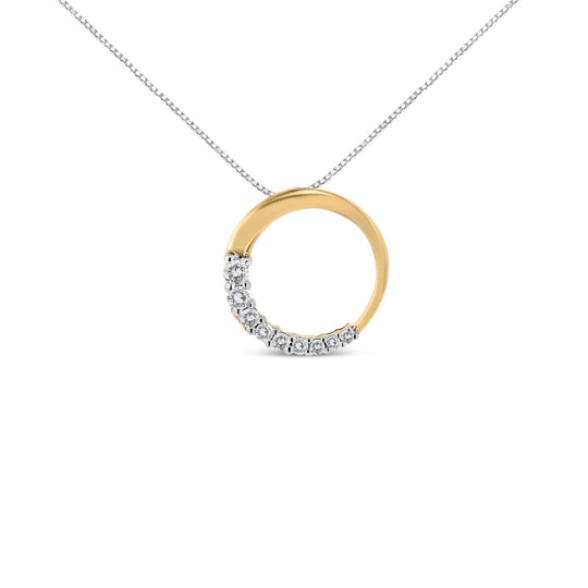 14K gold necklace with round diamond stones in a graduating open circle pendant