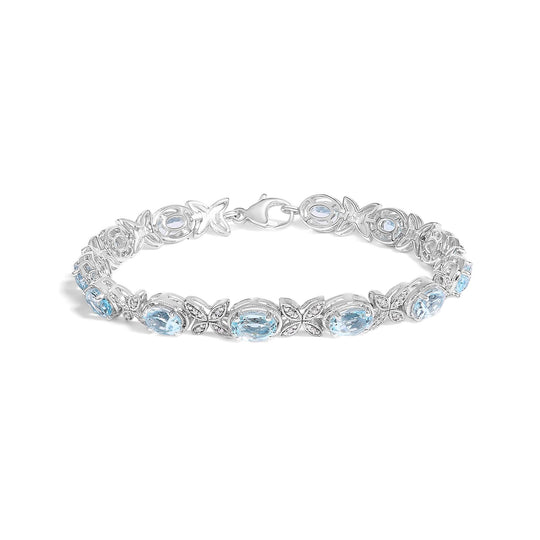 925 sterling silver butterfly link bracelet with oval blue topaz and diamond stones
