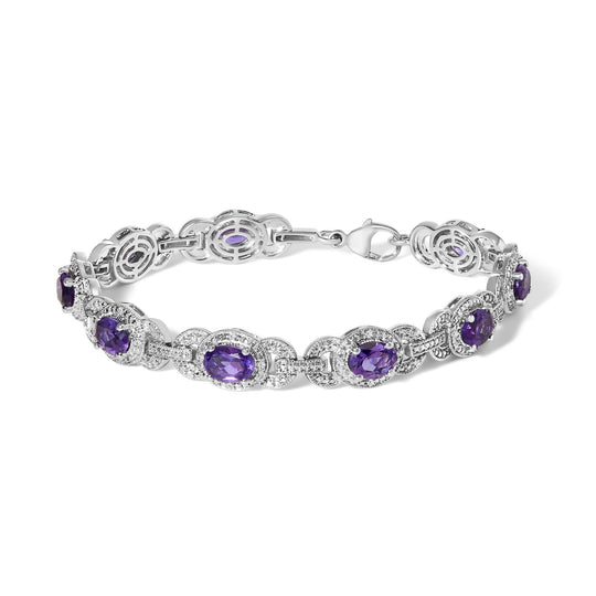 Sterling silver bracelet with oval purple amethyst stones in diamond halo links
