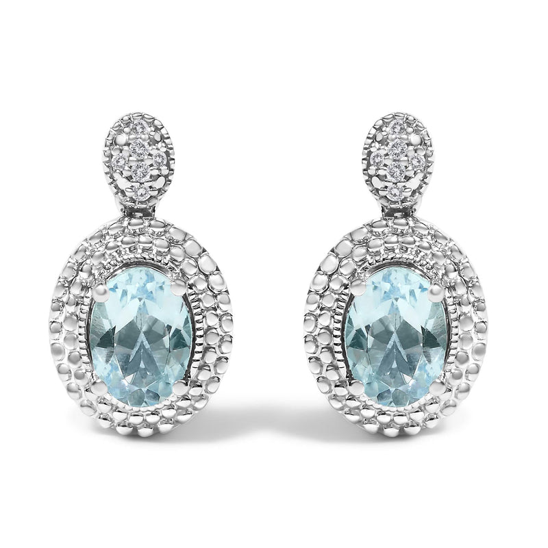 .925 Sterling Silver Diamond Accent and Oval Blue Topaz with Beaded Halo Drop Stud Earrings (I-J color, I1-I2 Clarity) 925 sterling silver drop stud earrings with oval blue topaz and diamond halo
