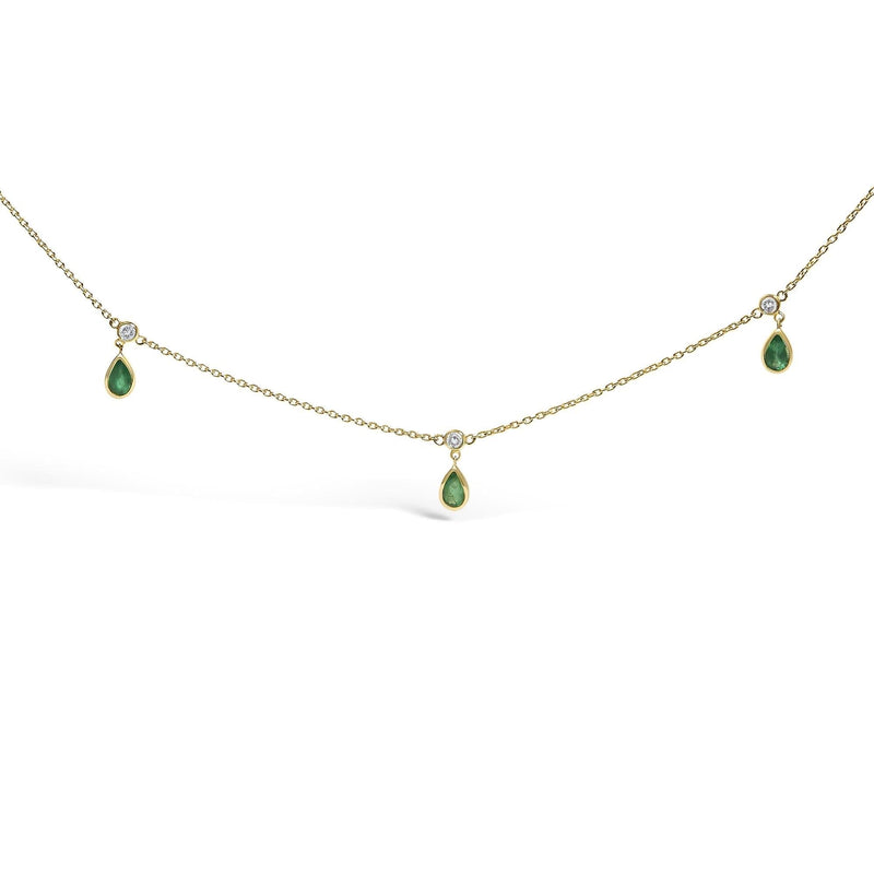 10K Yellow Gold Dangling 5x3 mm Green Emerald and Diamond Station Necklace - 18 10K yellow gold necklace with dangling green emerald and diamond stations
