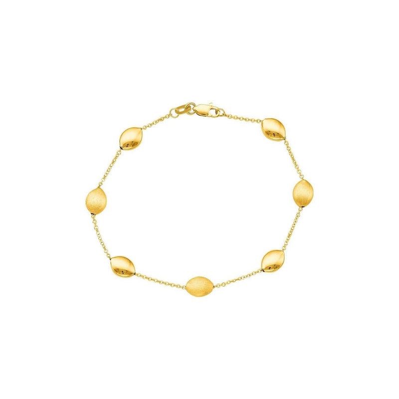 14k Yellow Gold Bracelet with Textured and Polished Pebble Stations 14K yellow gold textured pebble station bracelet