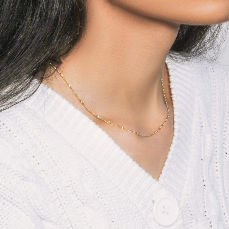 10k Yellow Gold Singapore Chain (1.50 mm) 10K yellow gold Singapore chain with 1.50 mm twisted spiral links