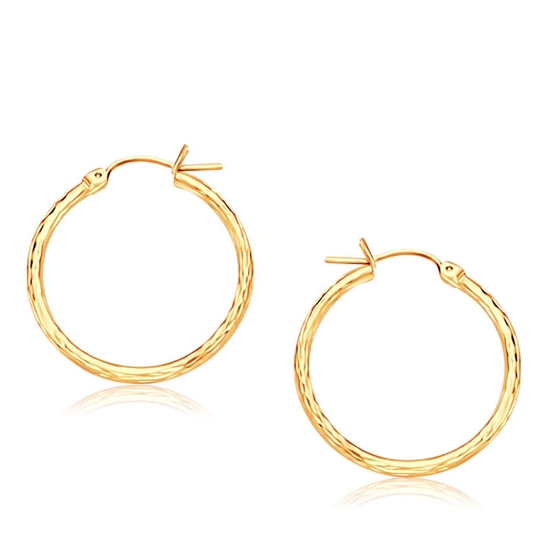 14K Yellow Gold Diamond Cut Hoop Earrings (25mm Diameter) 14K yellow gold diamond-cut hoop earrings, 25mm round faceted profile