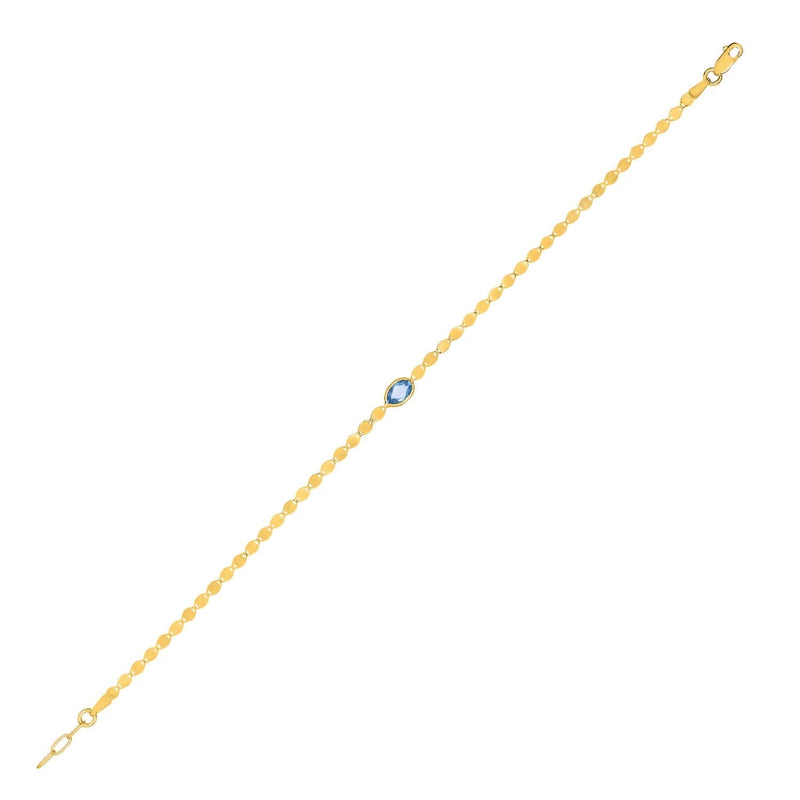 14K Yellow Gold Blue Topaz Mirrored Chain Bracelet (2.20 mm) 14K yellow gold bracelet with blue topaz accents on a 2.20 mm mirrored chain