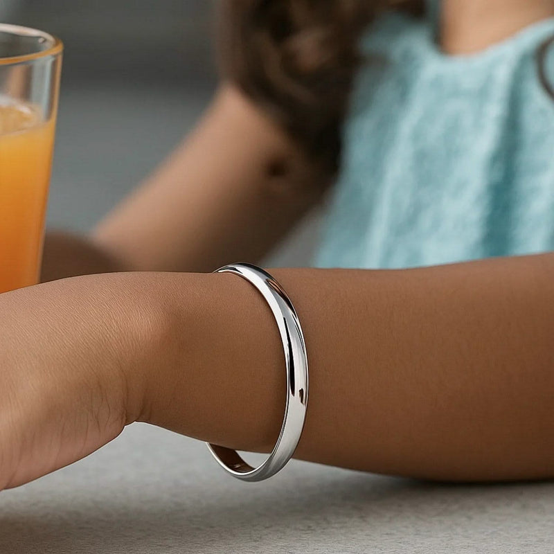 14k White Gold Dome Children's Bangle with a Polished Finish Product Image