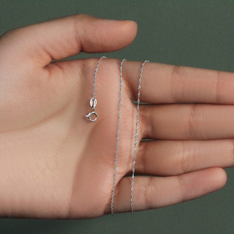 14k White Gold Singapore Chain 0.8mm (0.81 mm) 14K white gold Singapore chain with fine 0.8mm diamond-cut twisted links
