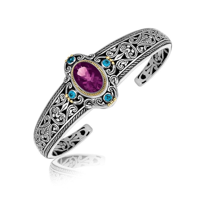 18K Yellow Gold and Sterling Silver Bangle with Amethyst and Blue Topaz Stations 18K yellow gold bangle with amethyst and blue topaz gemstone stations