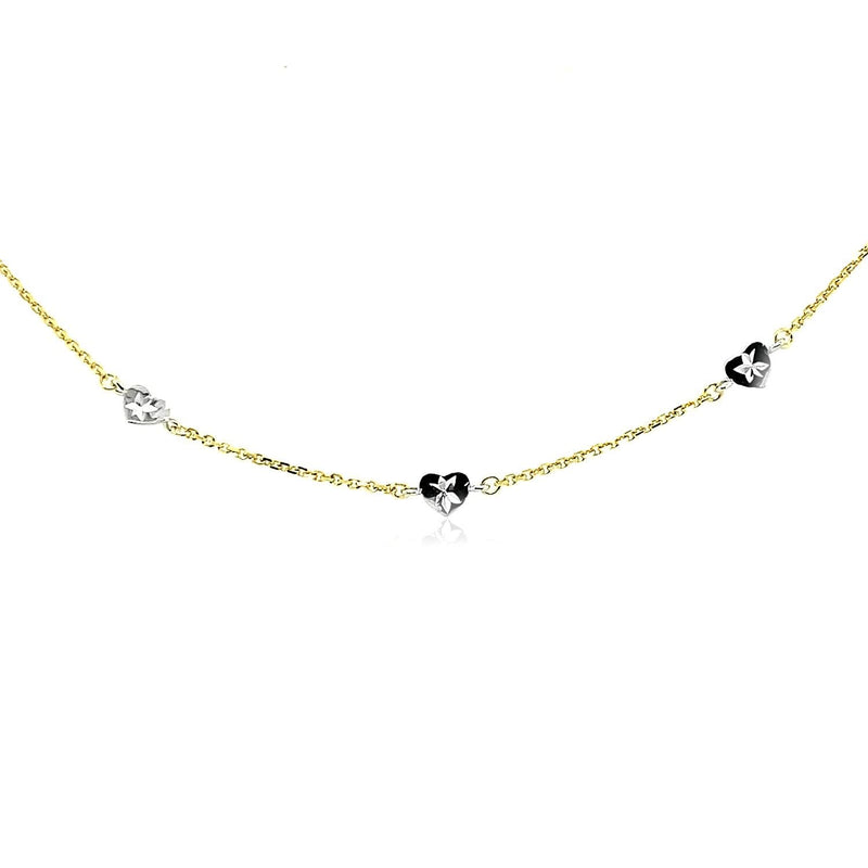 14k Two Tone Gold Anklet with Diamond Cut Heart Style Stations 14K two-tone gold anklet with diamond-cut heart stations