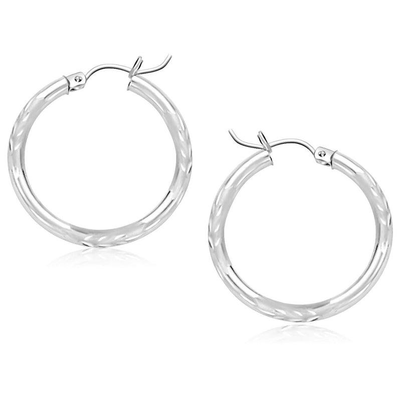 14k White Gold Diamond Cut Hoop Earrings (3x25mm) 14K white gold diamond-cut hoop earrings with faceted reflective surface