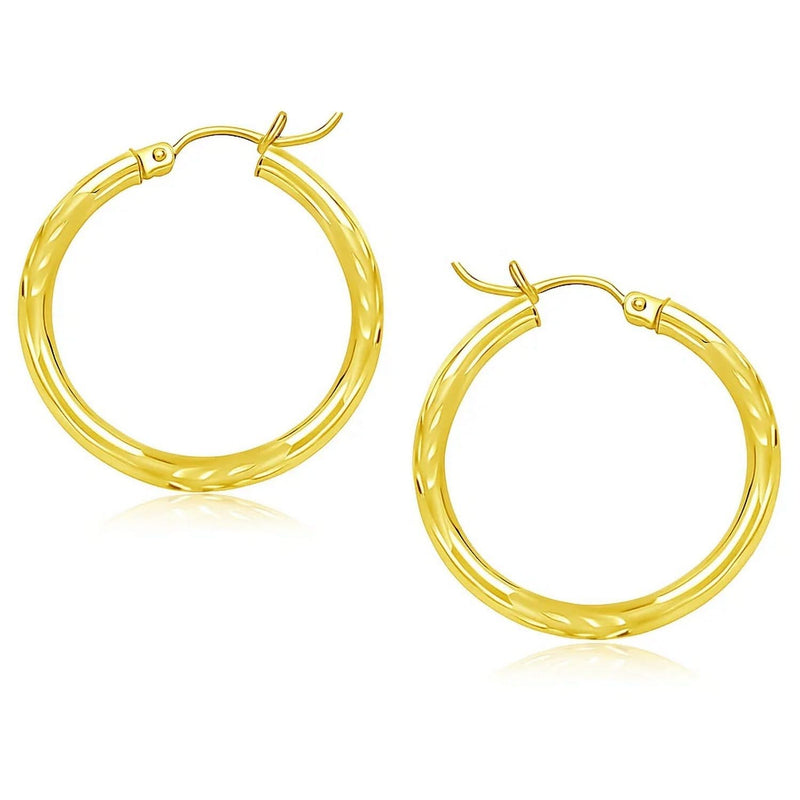 14k Yellow Gold Diamond Cut Hoop Earrings (3x25mm) 14K yellow gold diamond-cut hoop earrings with faceted 25mm profile
