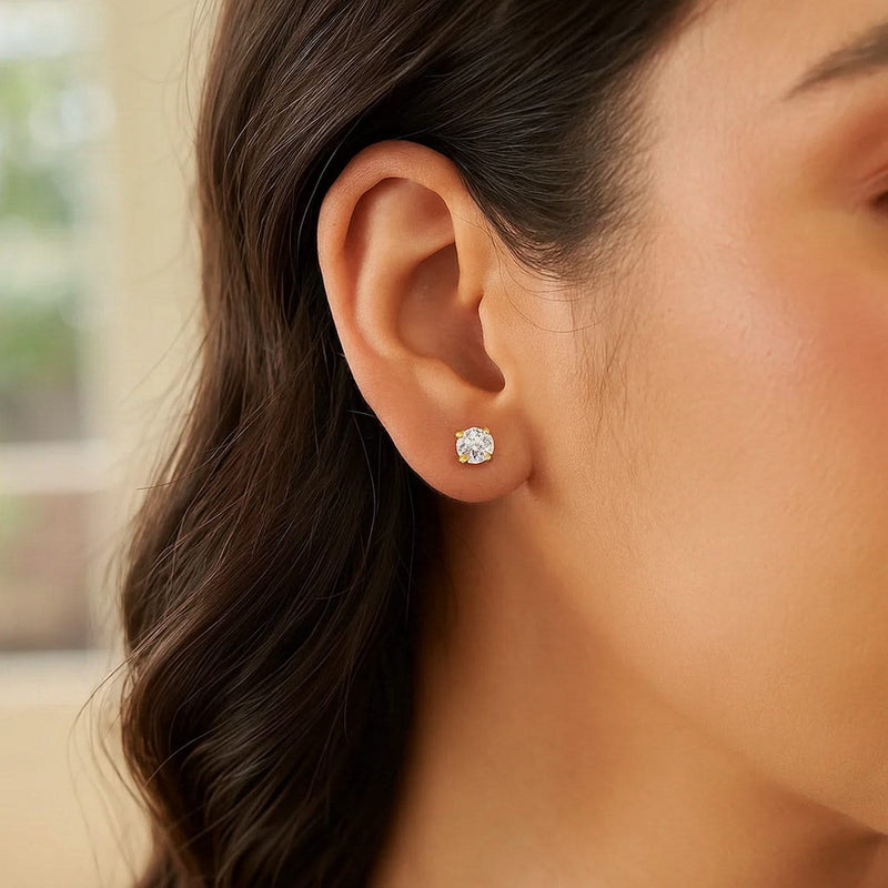 14k Yellow Gold Stud Earrings with White Hue Faceted Cubic Zirconia(4mm) 14K yellow gold stud earrings with 2 faceted cubic zirconia stones