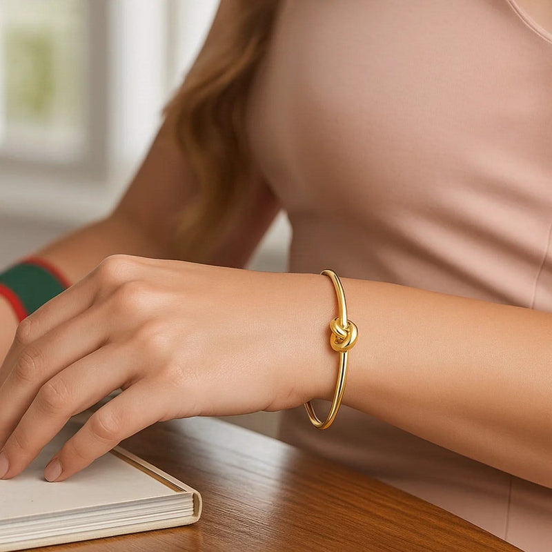 14k Yellow Gold Polished Cuff Bangle with Knot (5.50 mm) 14K yellow gold polished cuff bangle with knot detail, 5.50 mm wide