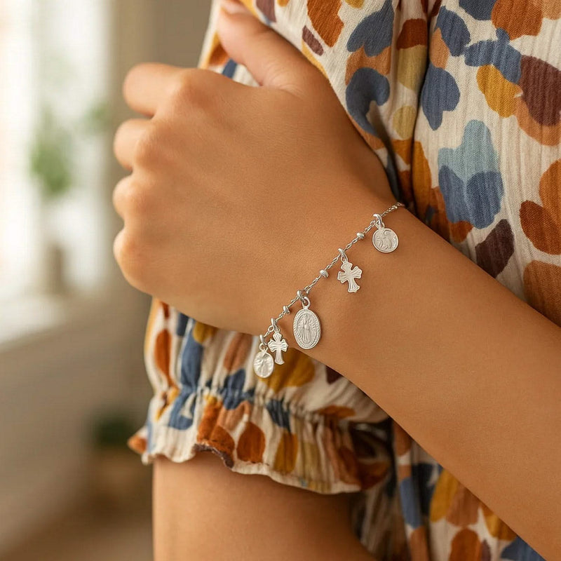 Sterling Silver 7 1/4 inch Bracelet with Crosses and Religious Medal Charms Sterling silver bracelet with cross and religious medal charms on a link chain