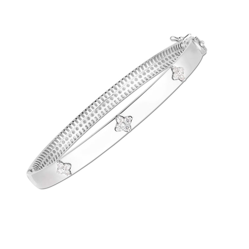 14k White Gold Trilogy Diamond Bangle (5.40 mm) 14K white gold bangle with three round diamond stones in a trilogy row