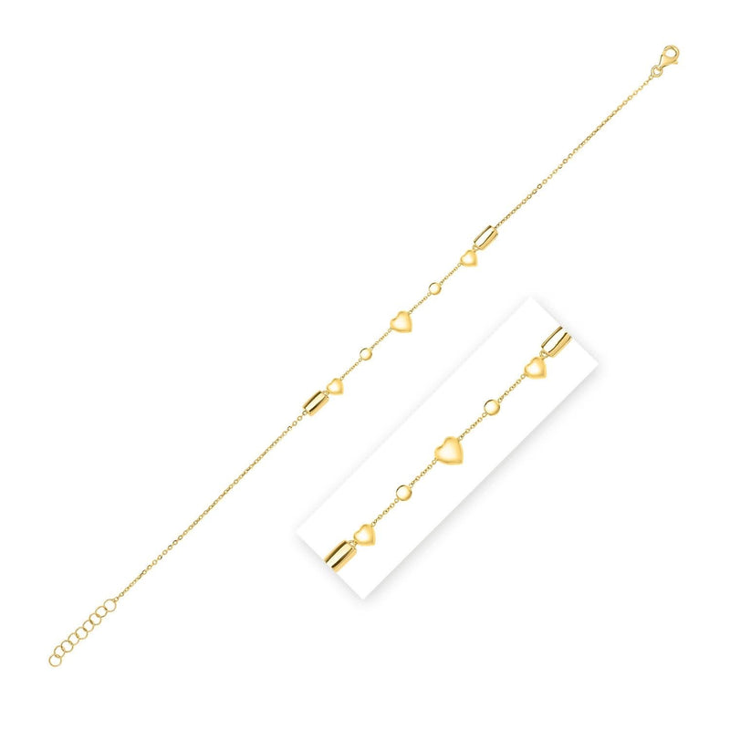 14k Yellow Gold Puff Heart Adjustable Anklet 14K yellow gold anklet with heart puff charms on a fine cable chain
