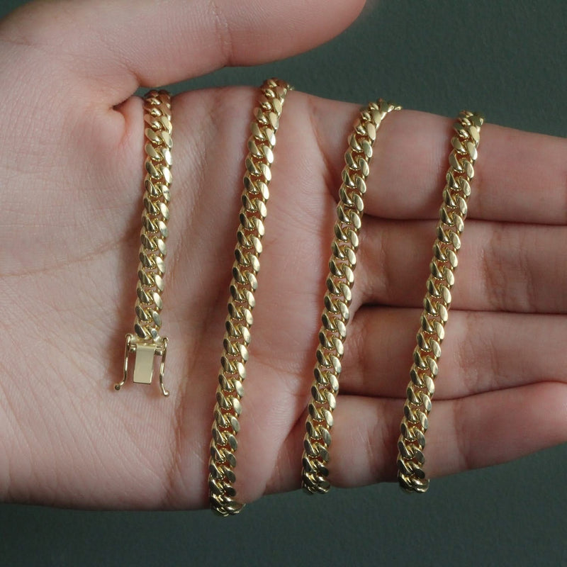 14k Yellow Gold Classic Miami Cuban Solid Chain (5.00 mm) 14K yellow gold Cuban chain with flat interlocking 5.00 mm links