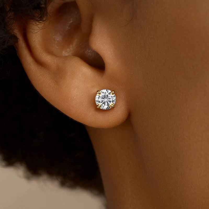 14k Yellow Gold Stud Earrings with White Hue Faceted Cubic Zirconia(5mm) 14K yellow gold stud earrings with 5mm faceted cubic zirconia stones