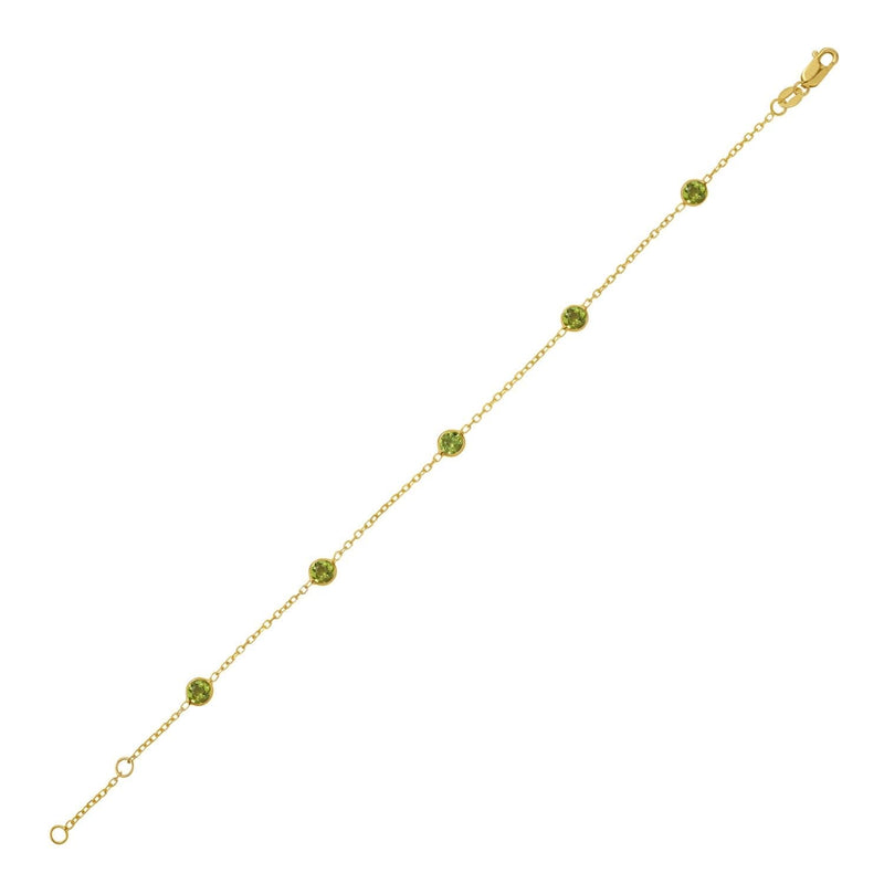 14K Yellow Gold Peridot Station Bracelet 14K yellow gold station bracelet with round peridot stones in bezel settings