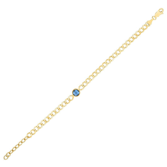 14K yellow gold curb chain bracelet with blue topaz accent stones