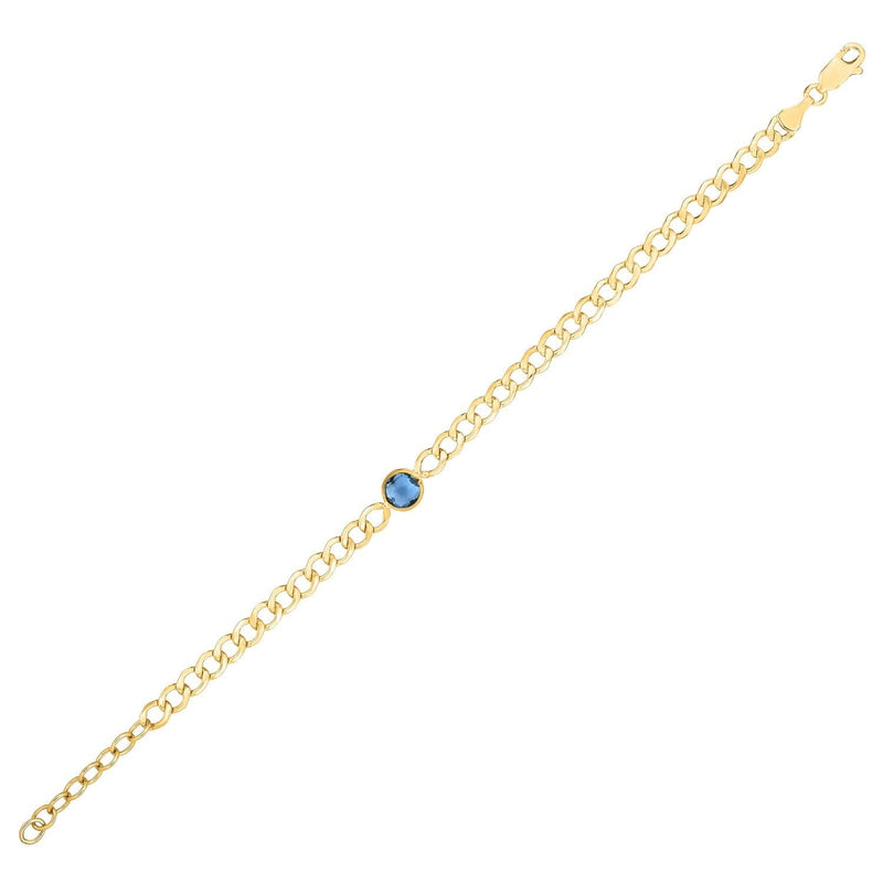 14K Yellow Gold Blue Topaz Curb Chain Bracelet (3.60 mm) 14K yellow gold curb chain bracelet with blue topaz accent stones