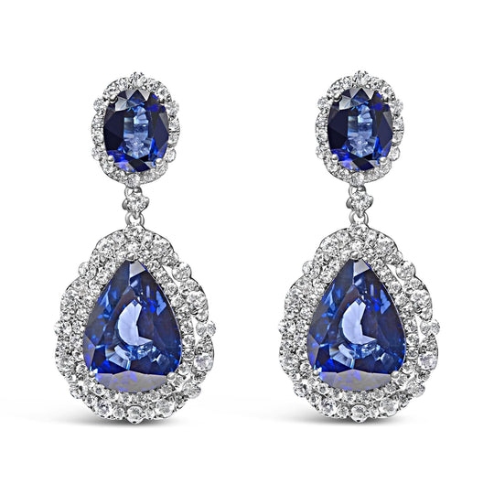 18K white gold ring with blue sapphire and halo diamond stones