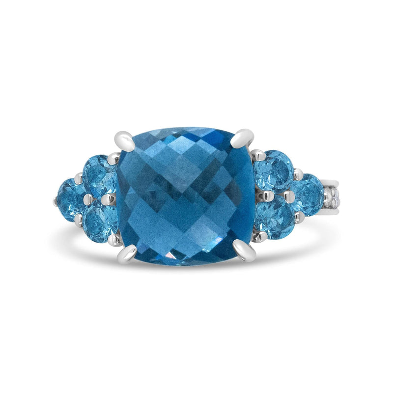 18K White Gold 10mm Cushion Shaped Blue Topaz and 1/6 Cttw Diamond 3 Stone Style Ring (F-G Color, VS1-VS2 Clarity) 18K white gold ring with 3 cushion blue topaz and diamond stones