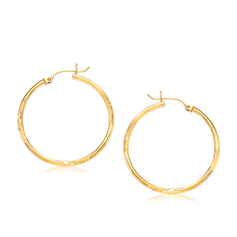 14k Yellow Gold Fancy Diamond Cut Slender Large Hoop Earrings (30mm Diameter) 14k Yellow Gold Fancy Diamond Cut Slender Large Hoop Earrings (30mm Diameter)