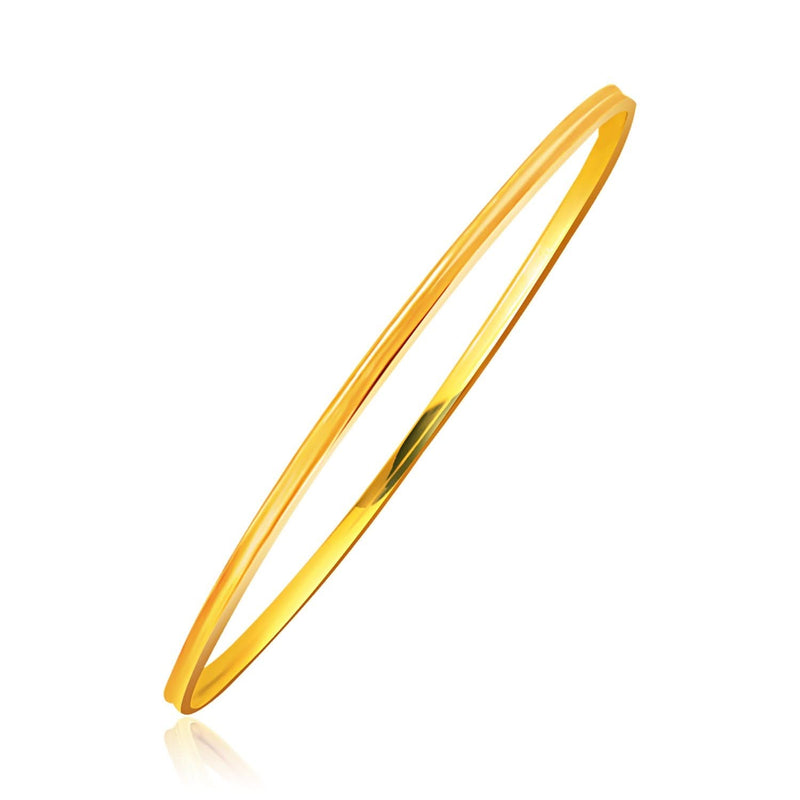 14K yellow gold thin stackable bangle with concave motif center channel