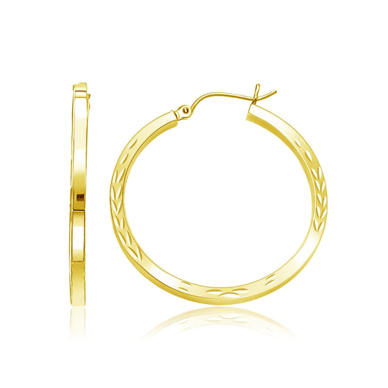 14k Yellow Gold Diamond Cut Hoop Earrings 14K yellow gold diamond-cut hoop earrings with faceted gold surface