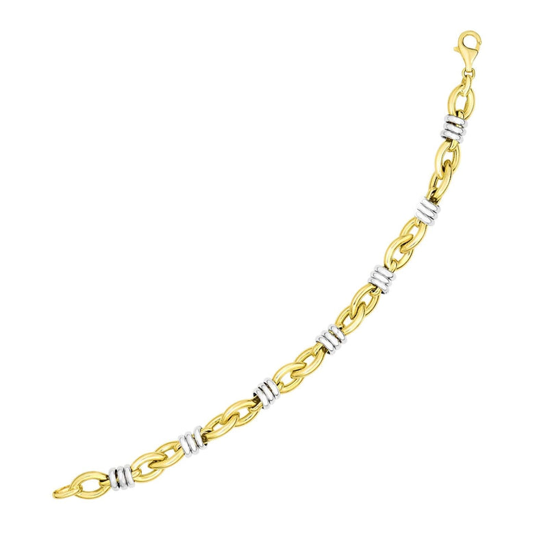14k Two-Tone Gold Ring-Wrapped Marquis Shape Link Bracelet 14K two-tone gold link bracelet with marquis-shaped ring-wrapped links