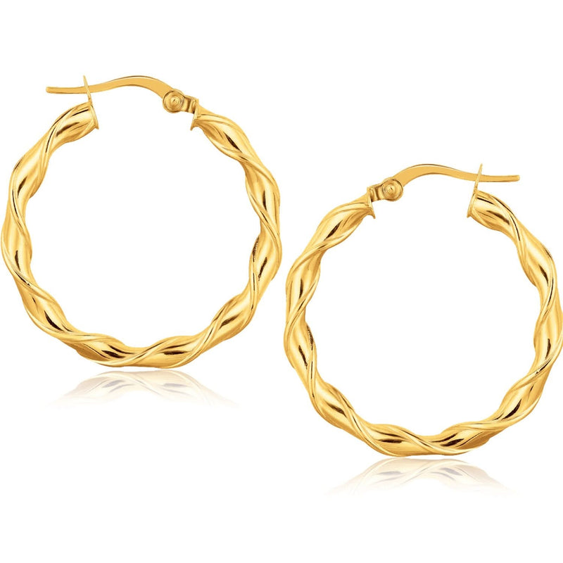 14K yellow gold hoop earrings with rounded tube profile, 1 1/8 inch