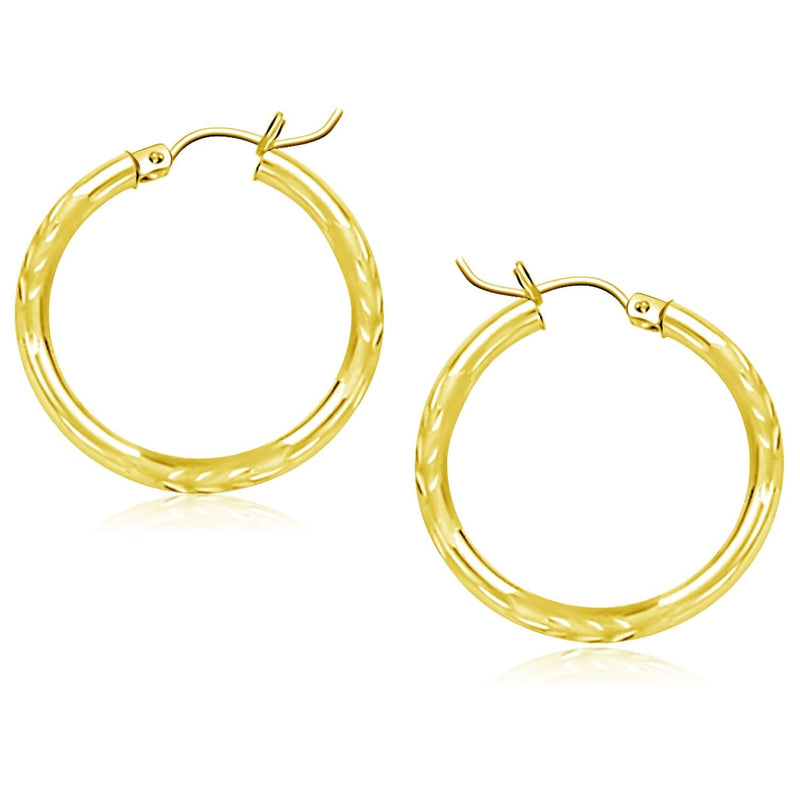 14k Yellow Gold Diamond Cut Hoop Earrings (25mm) 14K yellow gold hoop earrings with diamond-cut faceted finish, 25mm