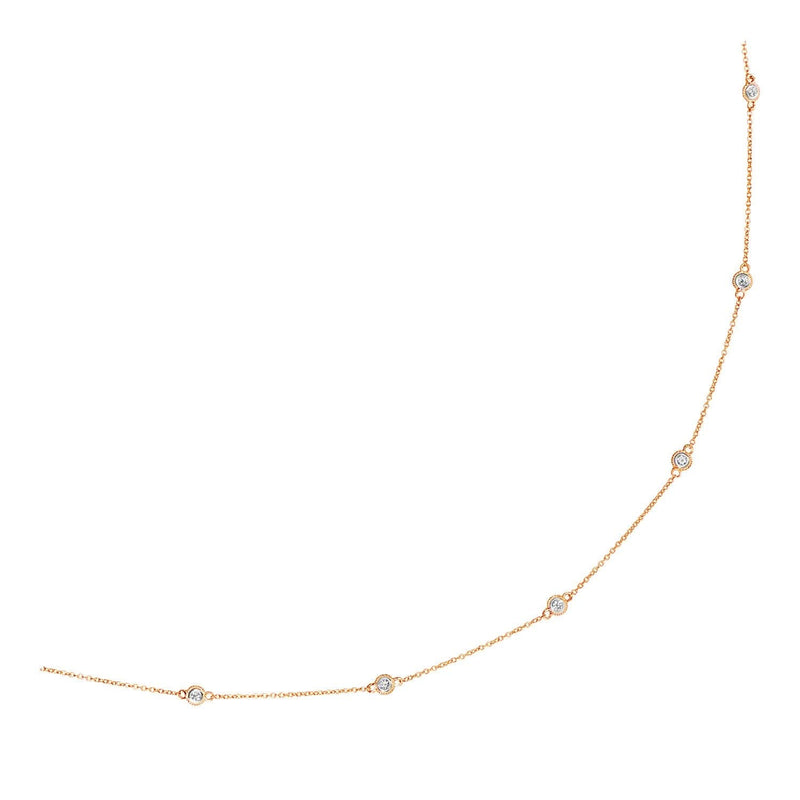 14k Rose Gold Station Necklace with Round Diamonds 14K rose gold station necklace with round diamond stones along the chain