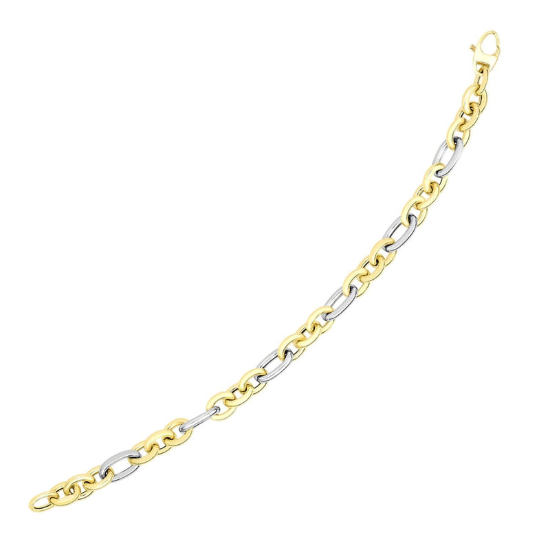 14k Two-Tone Gold Long and Short Style Oval Link Bracelet 14K two-tone gold oval link bracelet with long and short link pattern