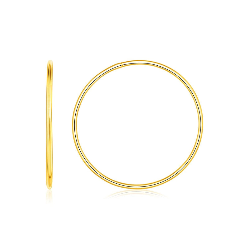 Endless Hoop Style Earrings in 14K Yellow Gold (1.6 g) 14K yellow gold endless hoop style earrings with seamless hinged closure