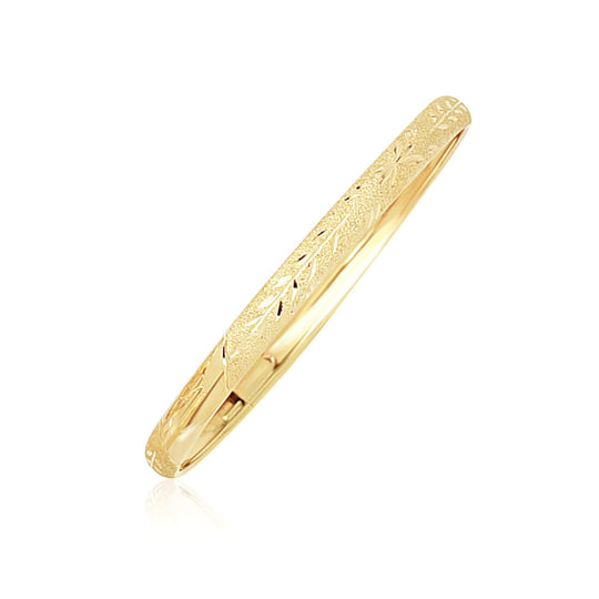 10K yellow gold children's bangle with diamond-cut Florentine finish
