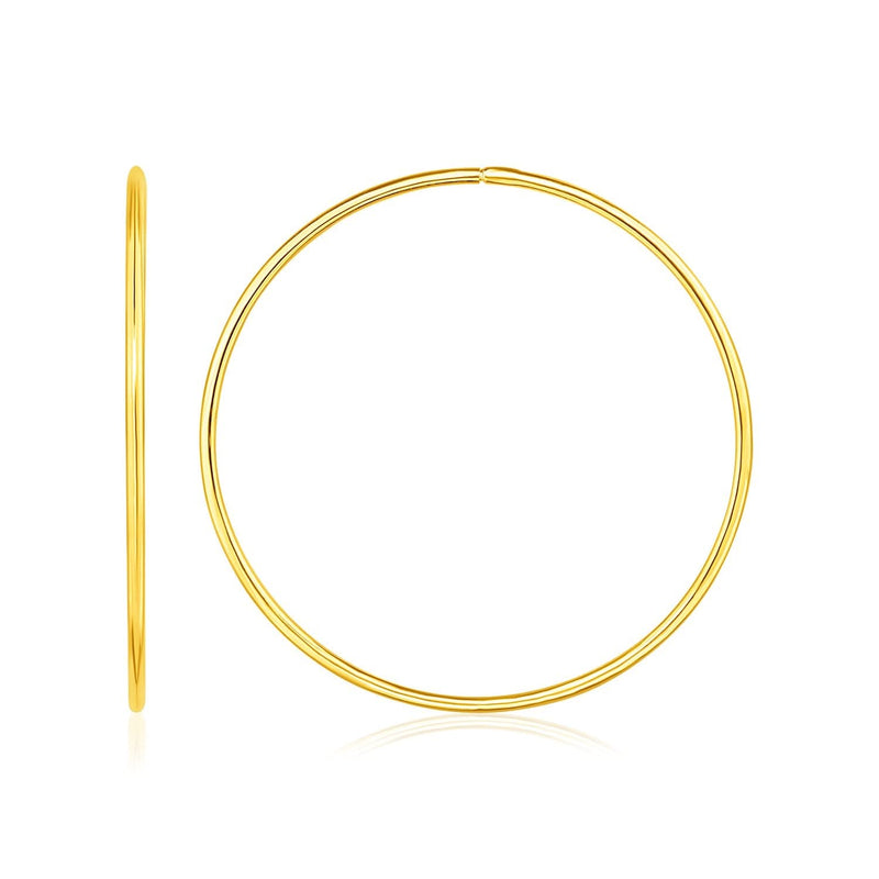 Endless Hoop Style Earrings in 14K Yellow Gold (2.3 g) 14K yellow gold endless hoop style ring with smooth clasp-free profile