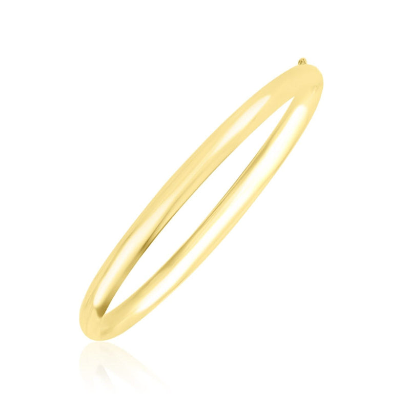 10k Yellow Gold Dome Style Shiny Bangle 10K yellow gold dome style shiny bangle with smooth polished band