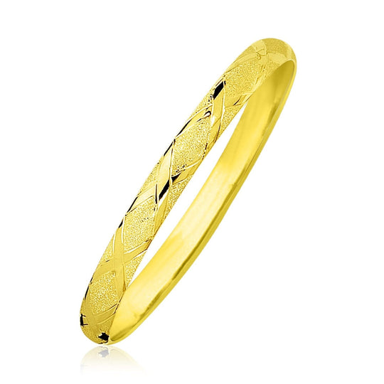 10K yellow gold bangle with slender diamond-pattern textured surface
