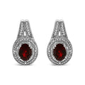925 sterling silver stud earrings with oval red garnet and diamond accent stones