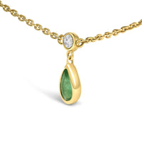 10K Yellow Gold Dangling 5x3 mm Green Emerald and Diamond Station Necklace - 18