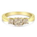 10K yellow gold ring with 3 round diamond stones in a row