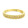 10K yellow gold ring with prong-set diamond stones and milgrain band edges